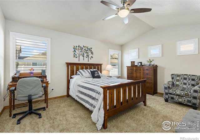 1613 Alpine Ave, Berthoud, CO 80513 - carpeted bedroom featuring multiple windows, vaulted ceiling, and a ceiling fan