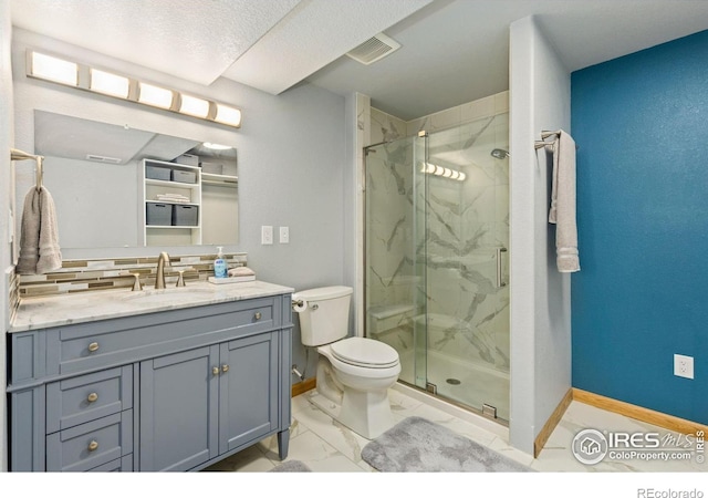 1613 Alpine Ave, Berthoud, CO 80513 - full bathroom featuring a marble finish shower, vanity, marble look tiles, and decorative backsplash