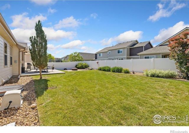 1613 Alpine Ave, Berthoud, CO 80513 - fenced backyard with a patio area and a residential view
