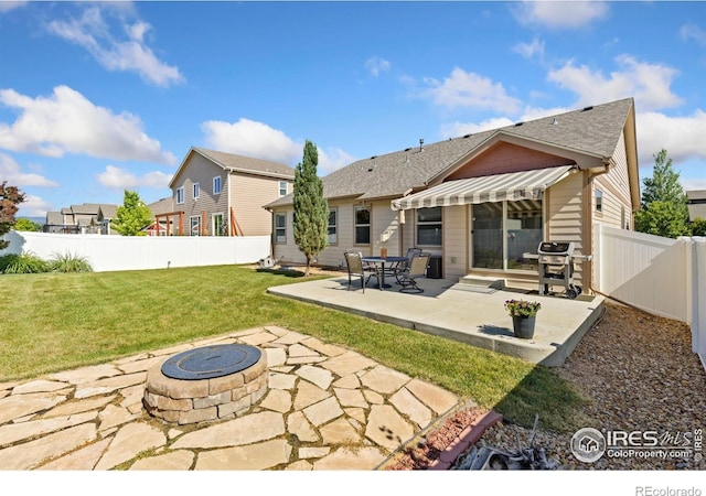 1613 Alpine Ave, Berthoud, CO 80513 - back of house featuring a fire pit, a fenced backyard, a patio area, and roof with shingles