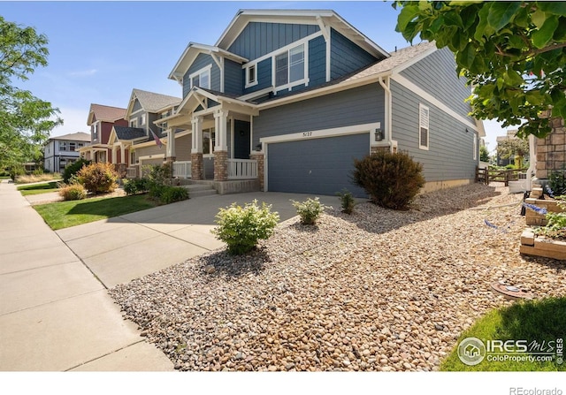 5127 Exploration Ln, Fort Collins, CO 80528 - craftsman-style house with concrete driveway, board and batten siding, and an attached garage