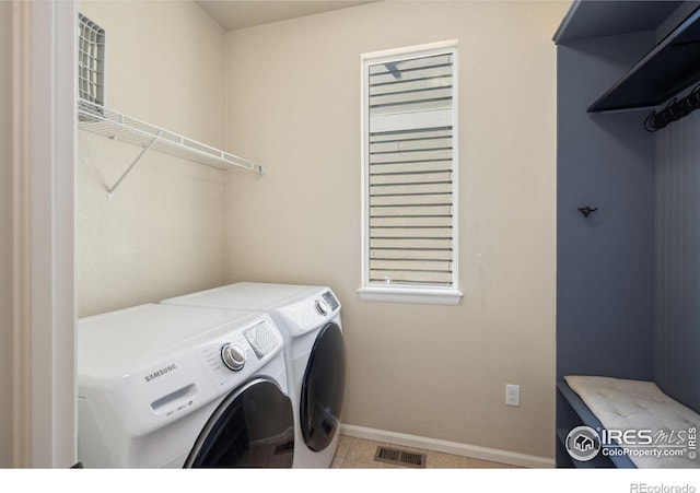 5127 Exploration Ln, Fort Collins, CO 80528 - laundry room with washer and clothes dryer and tile patterned floors