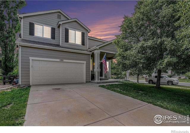 1201 102nd Ave, Greeley, CO 80634 - view of front of property with an attached garage, driveway, and a front yard