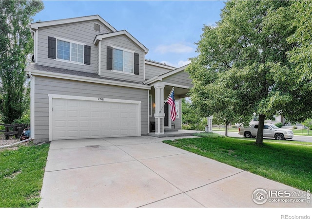 1201 102nd Ave, Greeley, CO 80634 - view of front of house with a garage, a front lawn, and concrete driveway