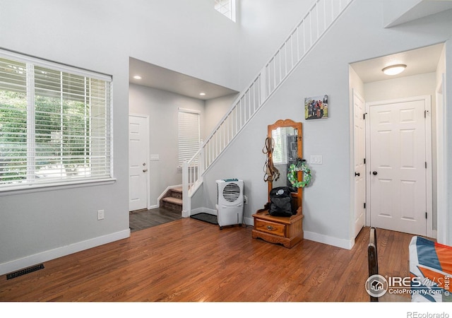 1201 102nd Ave, Greeley, CO 80634 - entrance foyer with wood finished floors, stairway, and recessed lighting