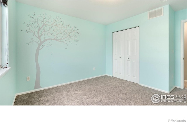 1937 Mahogany Way, Severance, CO 80550 - unfurnished bedroom with carpet floors and a closet