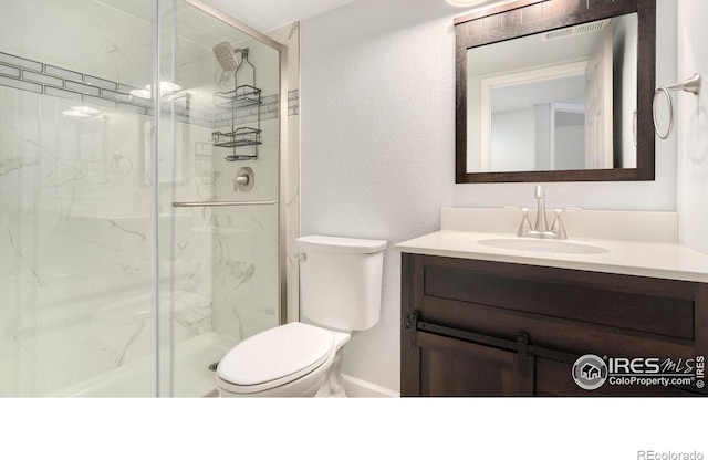 1937 Mahogany Way, Severance, CO 80550 - bathroom featuring a marble finish shower, vanity, and a textured wall