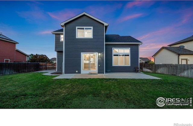 1937 Mahogany Way, Severance, CO 80550 - back of house with a patio area and a fenced backyard