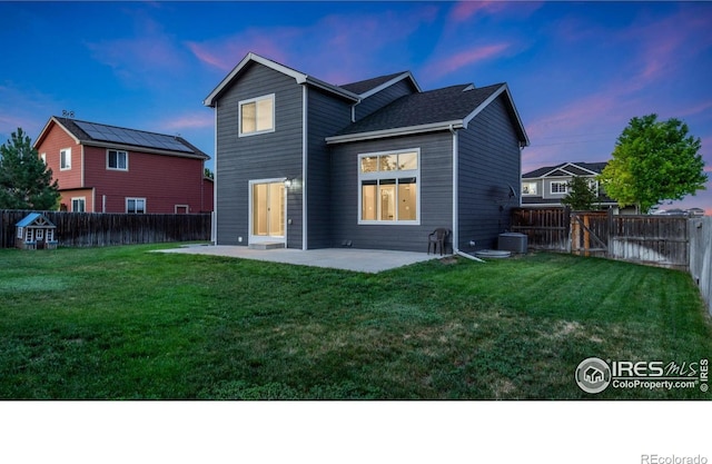1937 Mahogany Way, Severance, CO 80550 - back of property featuring a patio and a fenced backyard