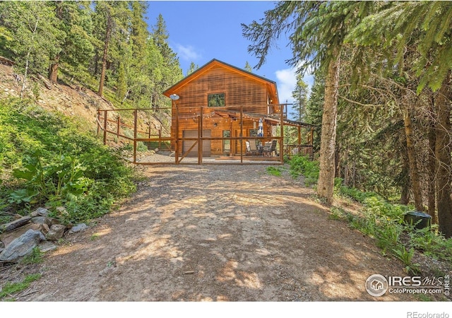 3727 Gamble Gulch Rd, Black Hawk, CO 80422 - chalet / cabin with a wooden deck and driveway