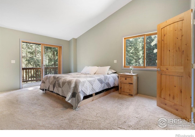 3727 Gamble Gulch Rd, Black Hawk, CO 80422 - bedroom featuring access to outside, vaulted ceiling, and light carpet
