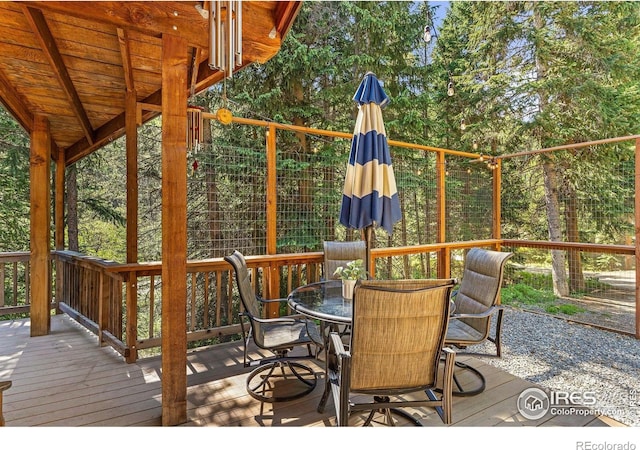 3727 Gamble Gulch Rd, Black Hawk, CO 80422 - wooden terrace with outdoor dining space