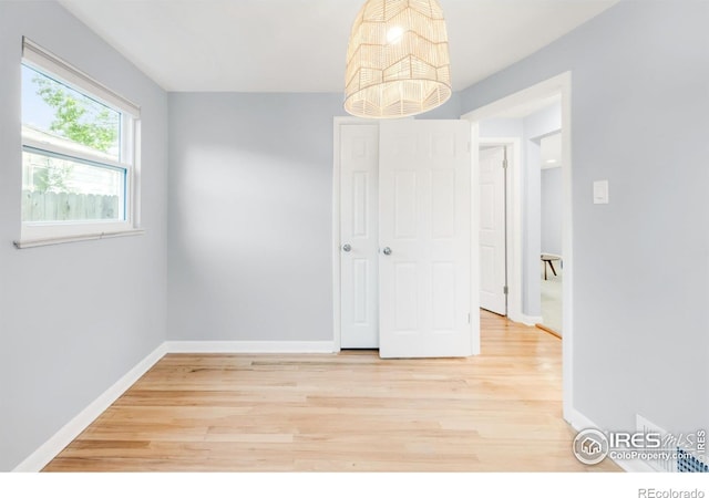 4240 Harlan St, Wheat Ridge, CO 80033 - unfurnished room with light wood finished floors and baseboards