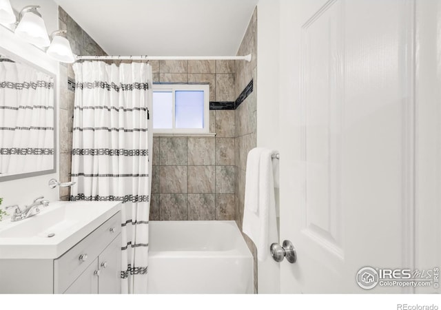 4240 Harlan St, Wheat Ridge, CO 80033 - bathroom with vanity and shower / bath combination with curtain