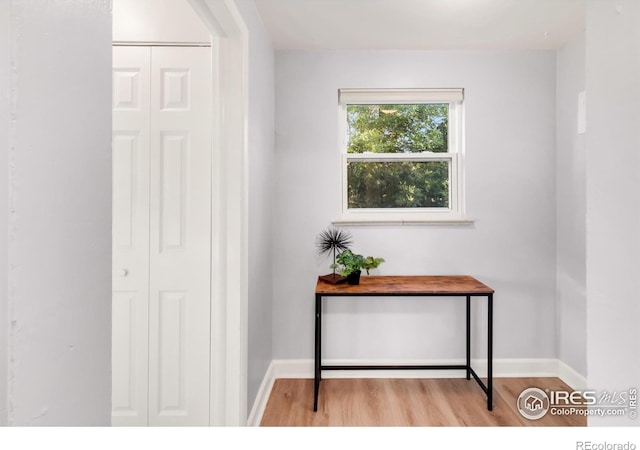 4240 Harlan St, Wheat Ridge, CO 80033 - hallway featuring wood finished floors and baseboards