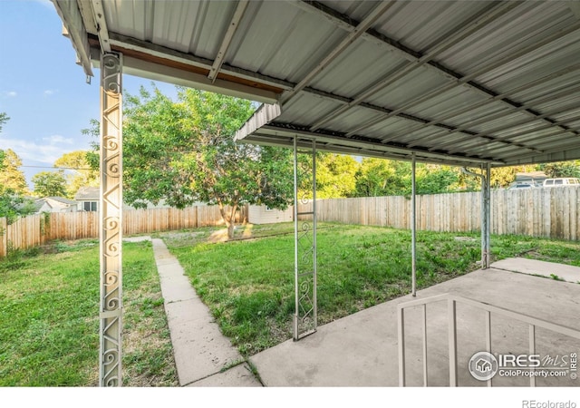 4240 Harlan St, Wheat Ridge, CO 80033 - fenced backyard with a patio area and an outbuilding