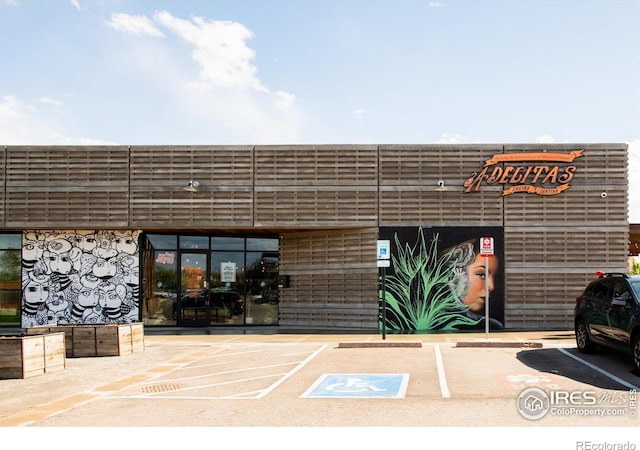 4240 Harlan St, Wheat Ridge, CO 80033 - view of building exterior featuring uncovered parking