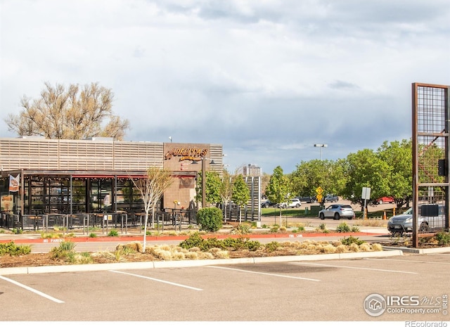 4240 Harlan St, Wheat Ridge, CO 80033 - view of building exterior with uncovered parking