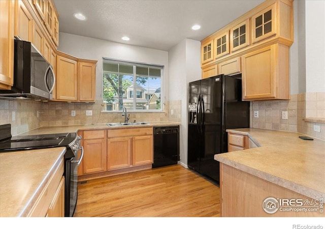 3632 Cassiopeia Ln, Fort Collins, CO 80528 - kitchen featuring black appliances, light brown cabinets, light wood-type flooring, decorative backsplash, and recessed lighting