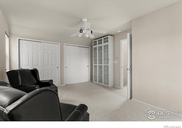 3632 Cassiopeia Ln, Fort Collins, CO 80528 - carpeted living area with baseboards and a ceiling fan