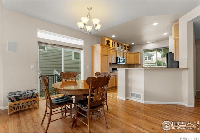3632 Cassiopeia Ln, Fort Collins, CO 80528 - dining area featuring light wood-style floors, a chandelier, and recessed lighting
