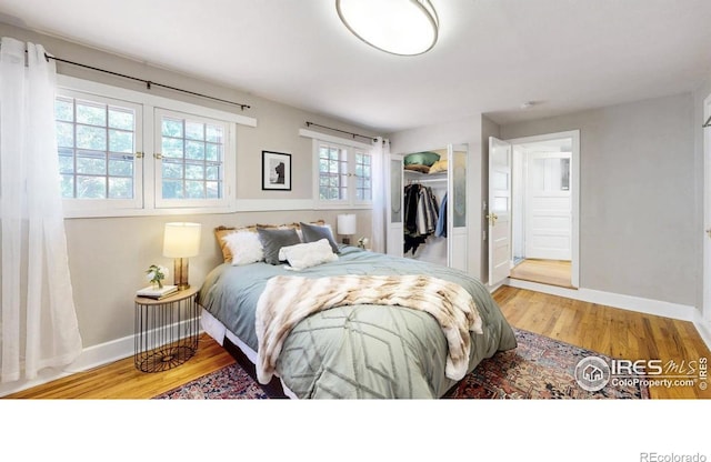 5326 Lowell Blvd, Denver, CO 80221 - bedroom featuring wood finished floors and a closet