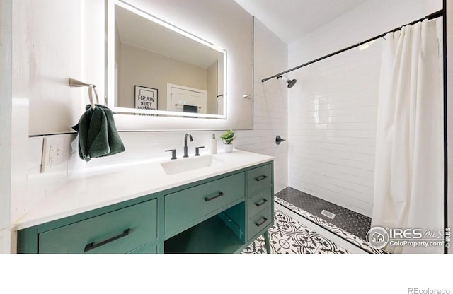 5326 Lowell Blvd, Denver, CO 80221 - bathroom with vanity, tiled shower, tile patterned floors, and tile walls