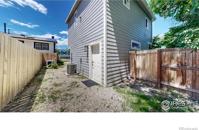 5326 Lowell Blvd, Denver, CO 80221 - view of side of property featuring a fenced backyard and a central AC unit