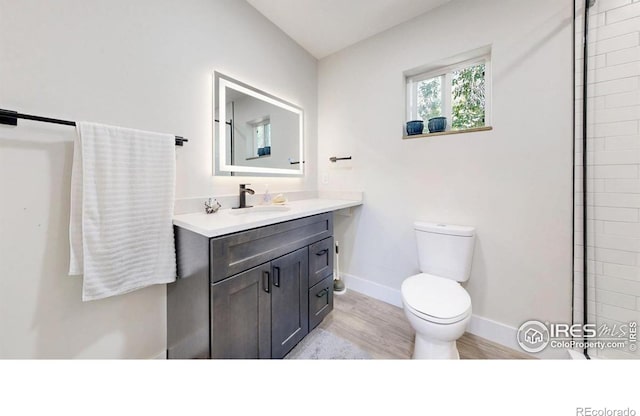 5326 Lowell Blvd, Denver, CO 80221 - bathroom featuring vanity and wood finished floors