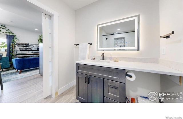 5326 Lowell Blvd, Denver, CO 80221 - bathroom with vanity, wood finished floors, and recessed lighting