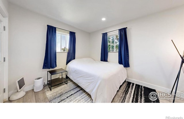5326 Lowell Blvd, Denver, CO 80221 - bedroom featuring wood finished floors and recessed lighting