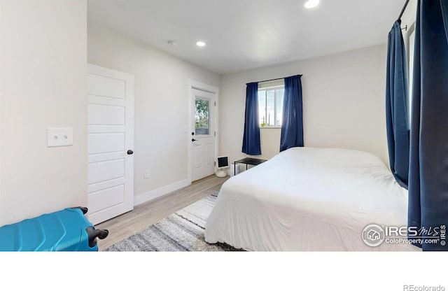 5326 Lowell Blvd, Denver, CO 80221 - bedroom with wood finished floors and recessed lighting