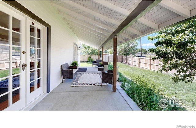 5326 Lowell Blvd, Denver, CO 80221 - fenced backyard with french doors, a patio, and an outdoor hangout area