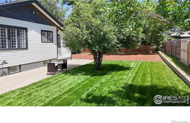 5326 Lowell Blvd, Denver, CO 80221 - fenced backyard featuring a patio area