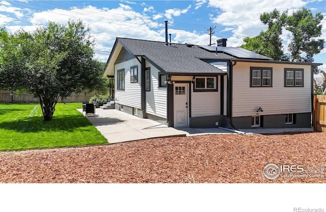5326 Lowell Blvd, Denver, CO 80221 - view of front of house featuring solar panels, a patio area, roof with shingles, and entry steps
