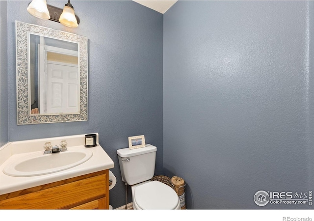 1026 Red Oak Dr, Longmont, CO 80504 - bathroom featuring vanity and a textured wall
