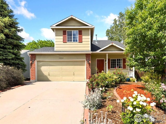1026 Red Oak Dr, Longmont, CO 80504 - traditional-style house featuring brick siding, driveway, covered porch, roof with shingles, and an attached garage