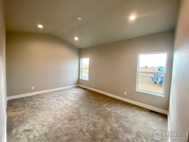 7156 Feather Reed Dr, Wellington, CO 80549 - spare room featuring vaulted ceiling, carpet floors, and recessed lighting