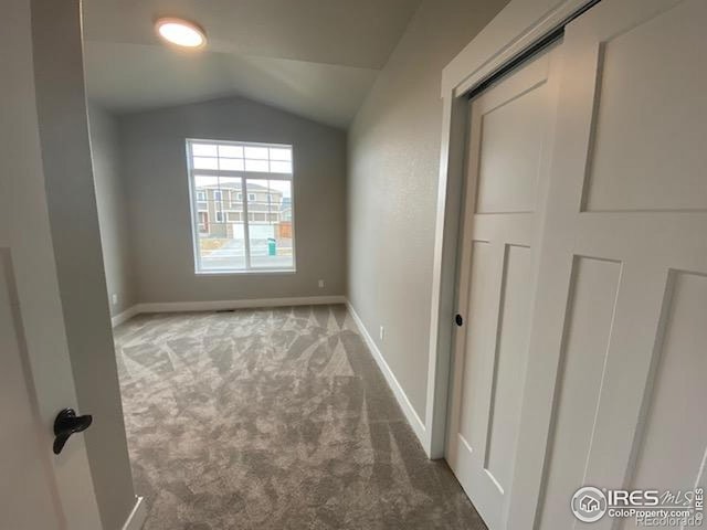 7156 Feather Reed Dr, Wellington, CO 80549 - unfurnished bedroom with carpet floors and vaulted ceiling