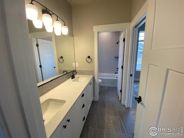 7156 Feather Reed Dr, Wellington, CO 80549 - full bath featuring double vanity and shower / tub combination