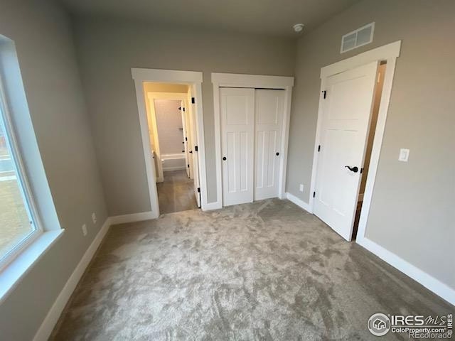 7156 Feather Reed Dr, Wellington, CO 80549 - unfurnished bedroom with carpet floors and a closet