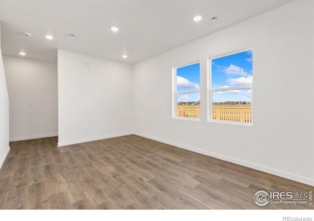 3178 Buffalo Grass Ln, Wellington, CO 80549 - spare room with recessed lighting and wood finished floors