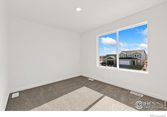 3178 Buffalo Grass Ln, Wellington, CO 80549 - spare room with dark carpet and recessed lighting