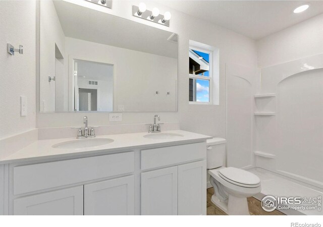 3178 Buffalo Grass Ln, Wellington, CO 80549 - bathroom with double vanity and a shower