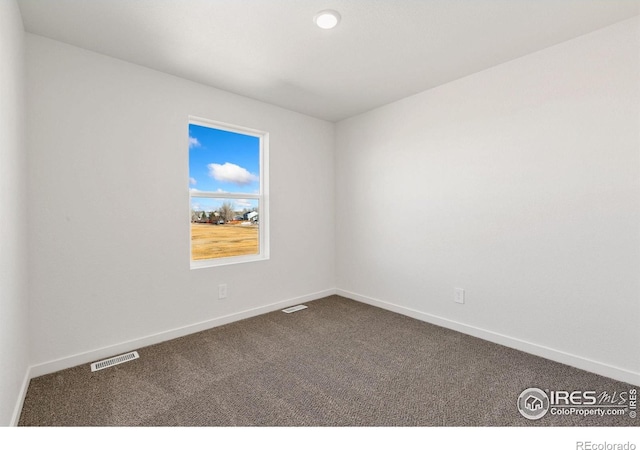 3178 Buffalo Grass Ln, Wellington, CO 80549 - empty room featuring dark carpet and baseboards