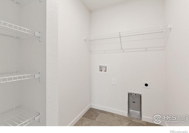 3178 Buffalo Grass Ln, Wellington, CO 80549 - washroom featuring washer hookup, electric dryer hookup, and light stone finish floors