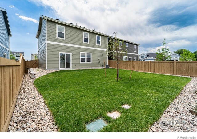 3178 Buffalo Grass Ln, Wellington, CO 80549 - rear view of house with a fenced backyard
