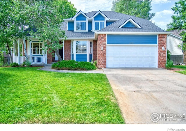 2408 Eagleview Cir, Longmont, CO 80504 - traditional-style home featuring a garage, a front yard, driveway, and brick siding