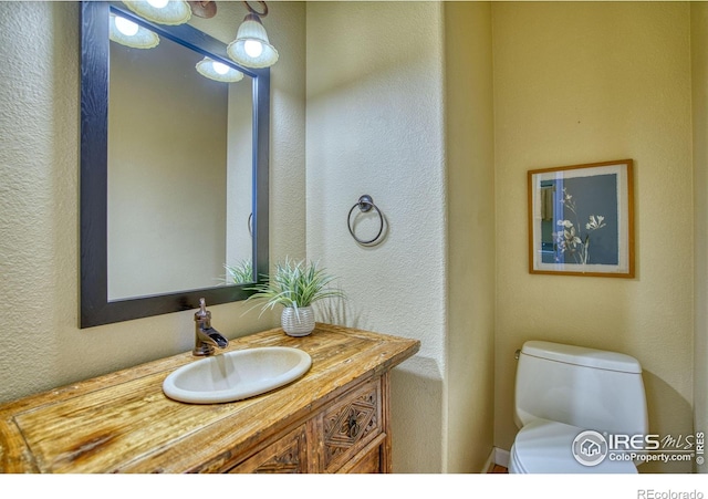 2408 Eagleview Cir, Longmont, CO 80504 - bathroom featuring vanity and a textured wall