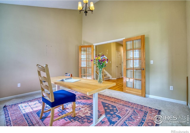 2408 Eagleview Cir, Longmont, CO 80504 - dining room with a chandelier, carpet flooring, and a high ceiling